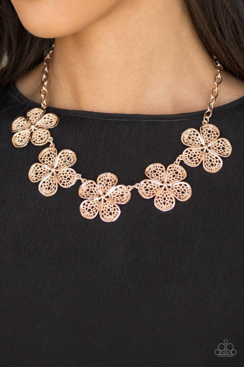 Paparazzi Accessories No Common Daisy - Gold Featuring lace-like petals, glistening rose gold daisies link below the collar for a seasonal look. Features an adjustable clasp closure. Jewelry