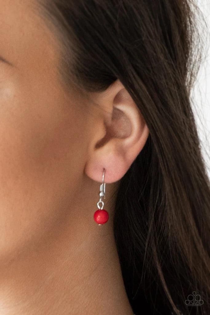 Paparazzi Accessories Flirty Foxtrot - Red Smooth and hammered silver rings join clusters of fiery red beads along a shimmery silver chain for a colorful look. Features an adjustable clasp closure. Sold as one individual necklace. Includes one pair of mat