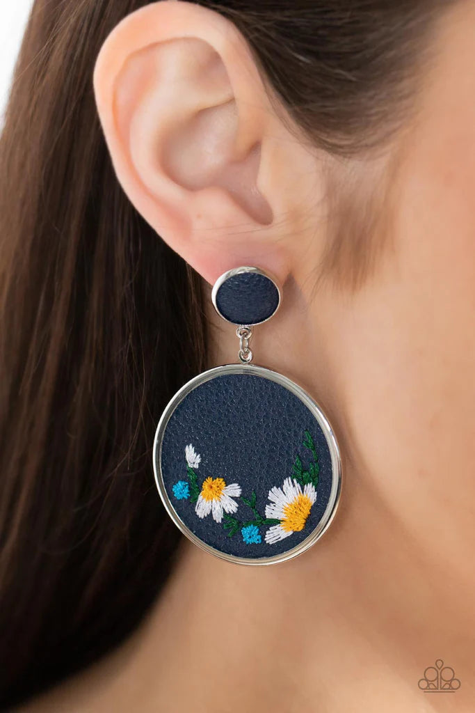 Paparazzi Accessories Embroidered Gardens - Blue A small Rhodonite leather disc, encased in a simple silver frame, anchors a larger Rhodonite circle that is adorned with fanciful embroidered flowers creating a whimsical lure. Earring attaches to a standar