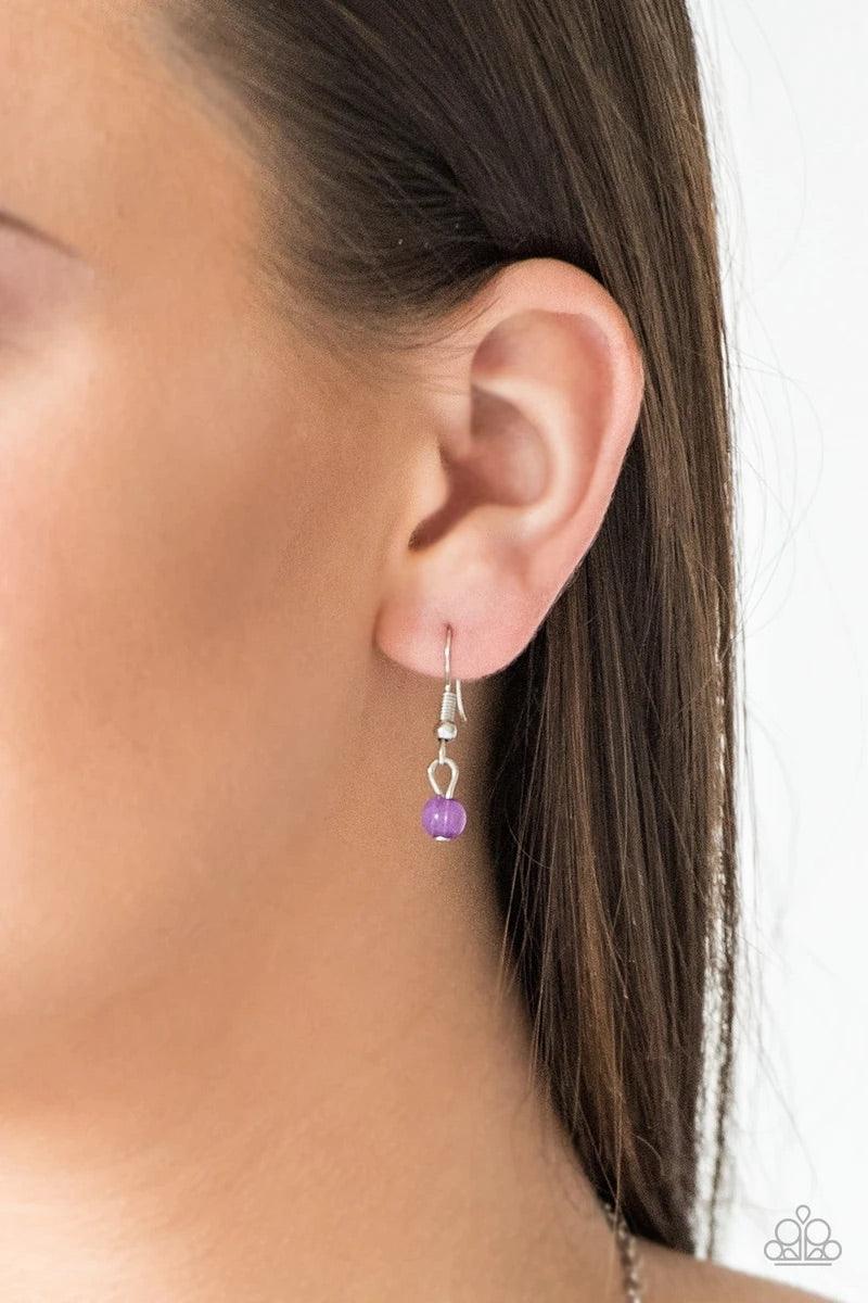 Paparazzi Accessories Colorful Cadence - Purple Faceted silver and glassy purple beads trickle along shimmery silver chains down the chest for a whimsical look. Features an adjustable clasp closure. Sold as one individual necklace. Includes one pair of ma