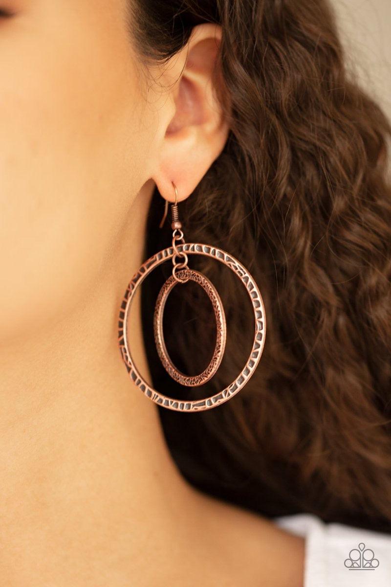 Paparazzi Accessories Fiercely Focused - Copper Mismatched copper hoops swing from the ear, creating a collision of metallic texture. Earring attaches to a standard fishhook fitting. Jewelry