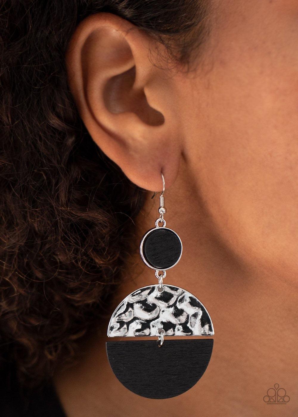 Paparazzi Accessories Natural Element - Black A black wooden crescent and hammered silver crescent link at the bottom of a round silver frame dotted with a black wooden center for an earthy flair. Earring attaches to a standard fishhook fitting. Sold as o