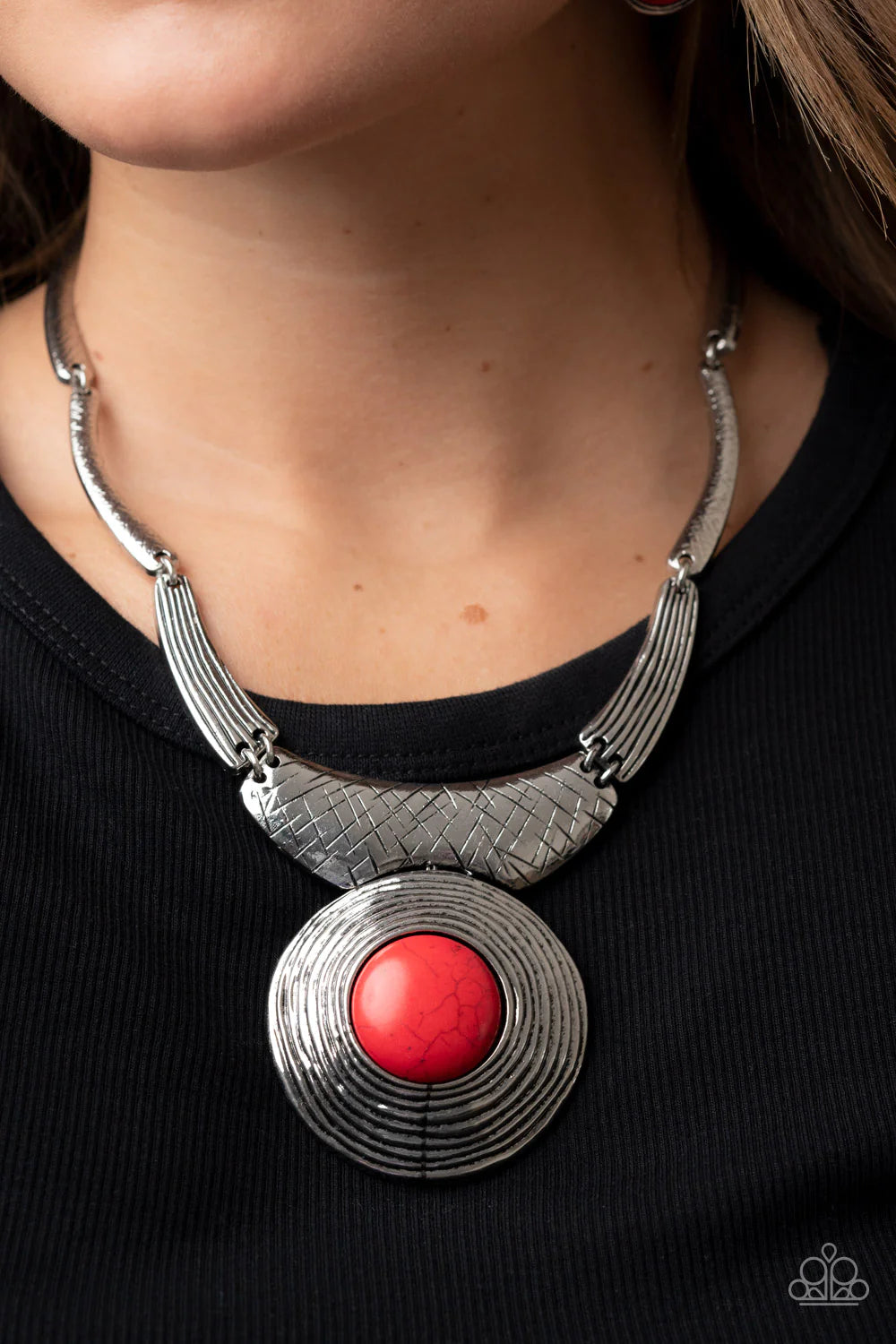 Paparazzi Accessories EMPRESS-ive Resume - Red Featuring hammered, scratched, and linear patterns, an antiqued assortment of gently curving silver frames boldly links below the collar. Dotted with an oversized red stone center, a rustic silver frame radia