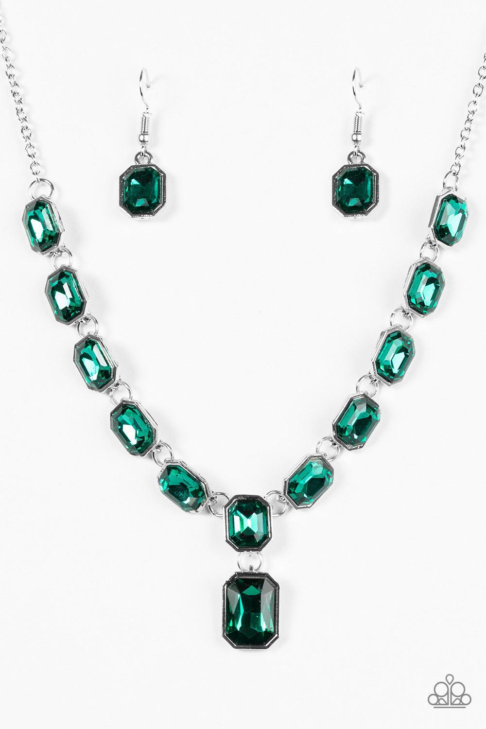Paparazzi Accessories The Right To Remain Sparkly - Green Featuring regal emerald style cuts, glittery green gems link below the collar in an undeniably sparkly fashion. A slightly larger gem swings from the center, creating an eye-catching pendant. Featu