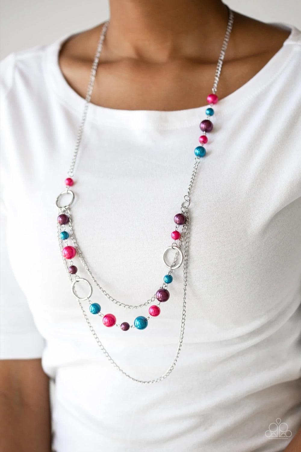 Paparazzi Accessories Party Dress Princess - Multi Pearly blue, pink, and purple beads and shimmery silver hoops trickle along glistening silver chains, creating mismatched layers down the chest. Features an adjustable clasp closure. Jewelry