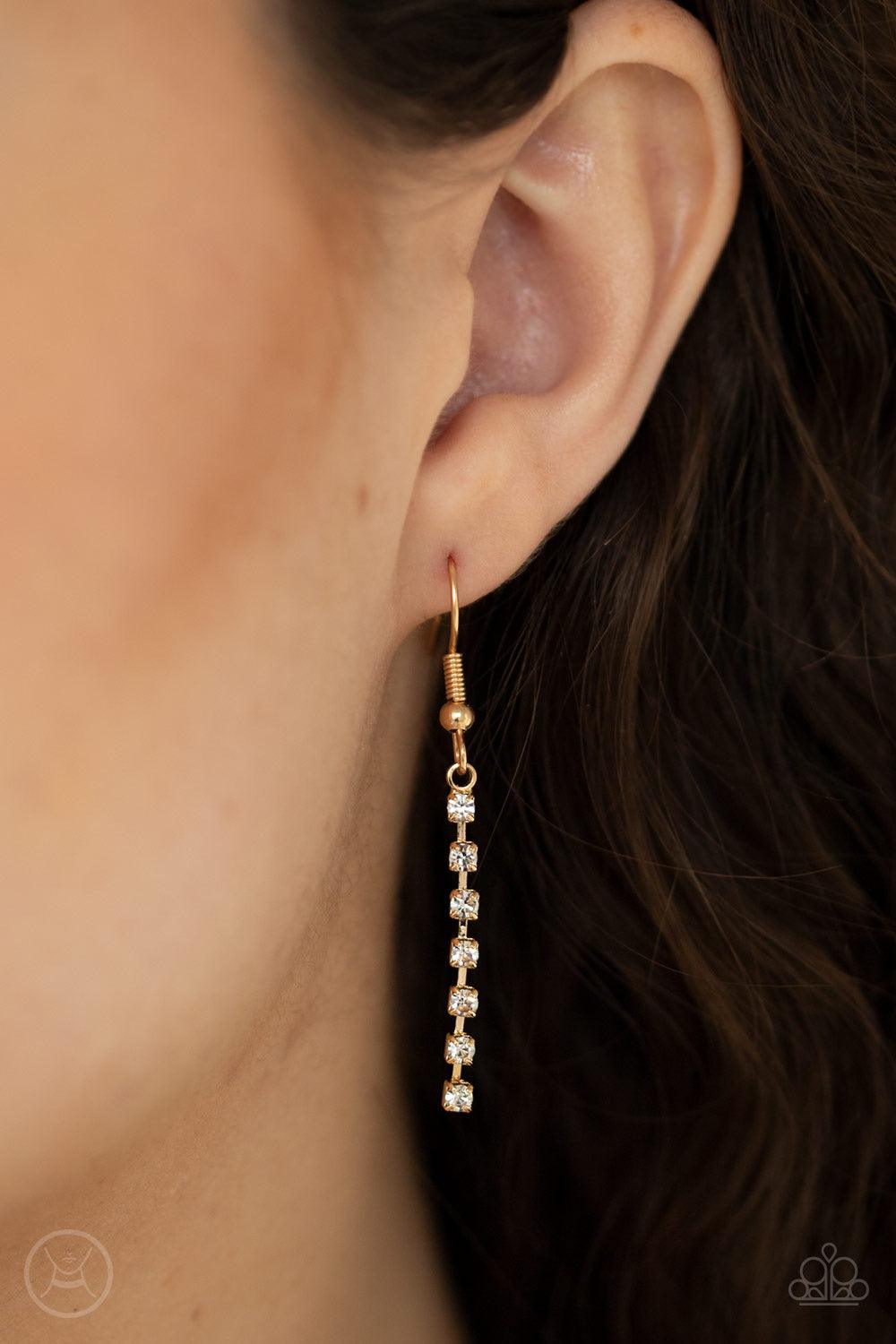 Paparazzi Accessories Ante Up - Gold Featuring sleek gold fittings, two strands of glittery white rhinestones join into a sparkling chain below the collar. Chains flow in from both sides at varying lengths creating a glamorously asymmetrical pendant. Feat