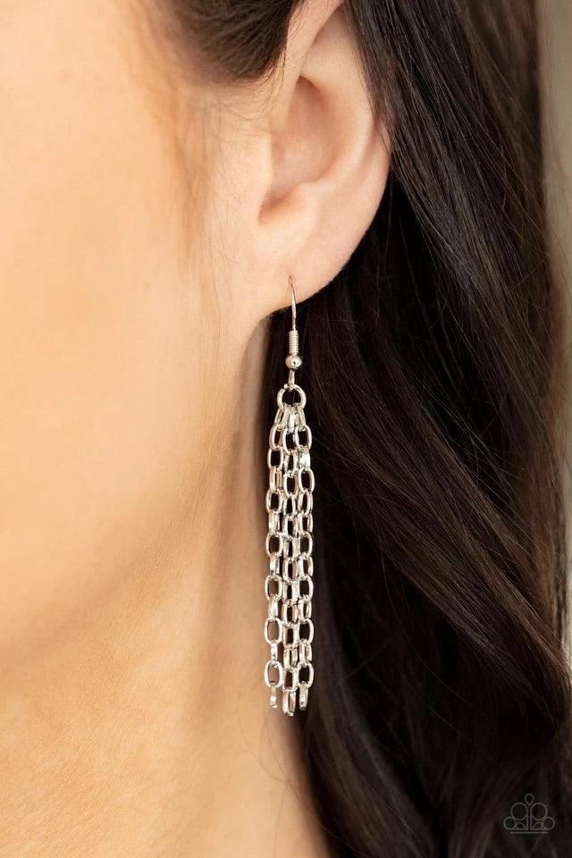 Paparazzi Accessories Absolute Admiration - Purple Encased in hammered asymmetrical silver frames, an imperfect collection of faceted purple gems are suspended from two shimmery silver chains as they double-link below the collar for a dramatic effect. Fea