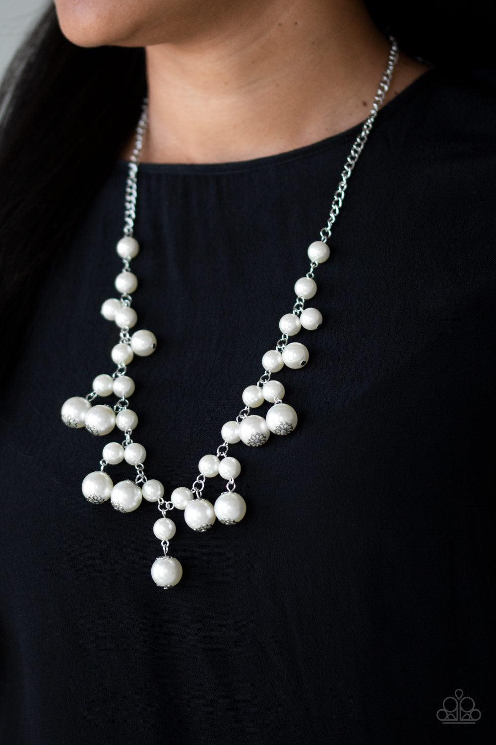 Paparazzi Accessories Soon To Be Mrs. - White Varying in size, bubbly white pearls swing from the bottom of a classic strand of pearls, creating a refined fringe below the collar. Features an adjustable clasp closure. Jewelry