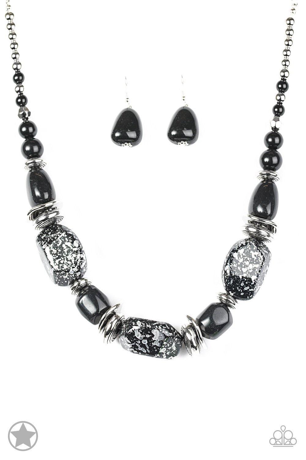 Paparazzi Accessories In Good Glazes - Black Chunky black beads with speckles of silver and a gorgeous glazed finish are threaded together with thick silver rings and smooth black beads. Features an adjustable clasp closure. Jewelry