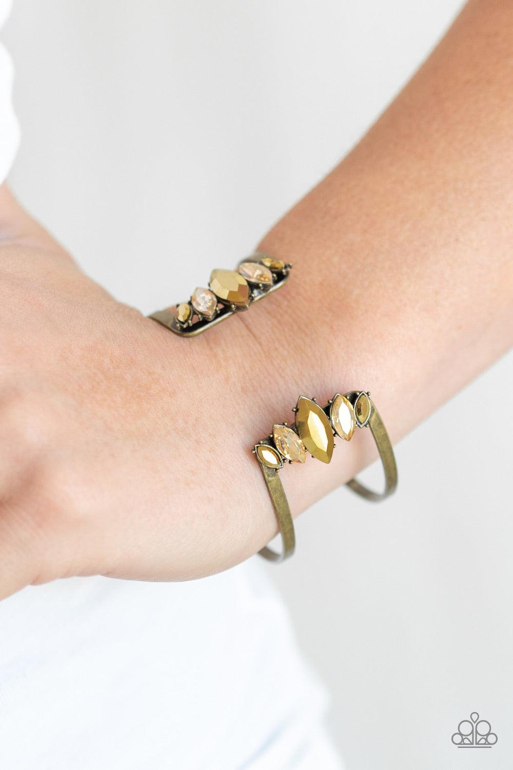 Paparazzi Accessories Glam Power - Brass Featuring regal marquise style cuts, an array of golden topaz and aurum rhinestones decorate the edges of an airy brass cuff for an edgy, glamorous finish. Jewelry
