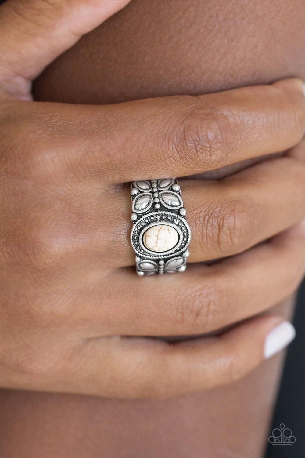 Paparazzi Accessories Butterfly Belle - White A refreshing white stone is pressed into a shimmery silver band radiating with butterfly details for a whimsical look. Features a stretchy band for a flexible fit. Sold as one individual ring. Jewelry