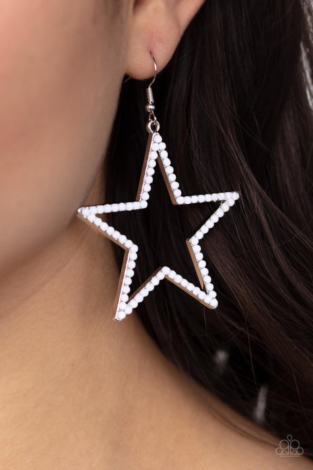 Paparazzi Accessories Count Your Star - White Dotted in dainty white beads, an airy star frame swings from the ear for a patriotic style. Earring attaches to a standard fishhook fitting. Jewelry