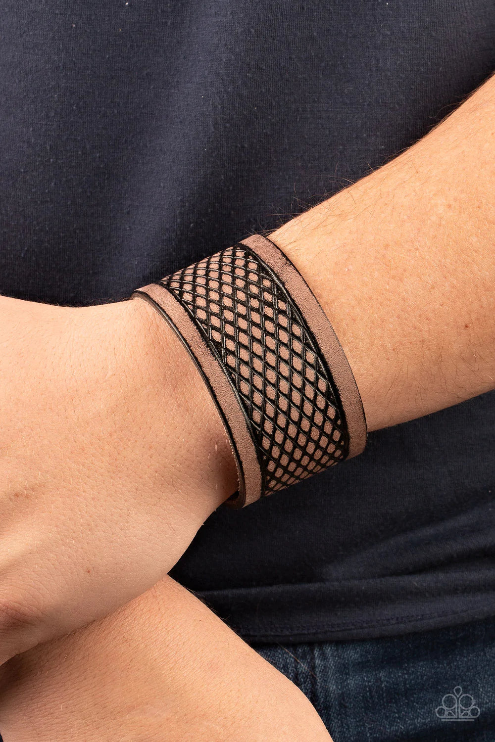 Paparazzi Accessories Country Cobra - Brown Stamped in a distressed diamond pattern, an oversized brown leather band curls around the wrist for a rustic effect. Features an adjustable snap closure. Sold as one individual bracelet. Jewelry