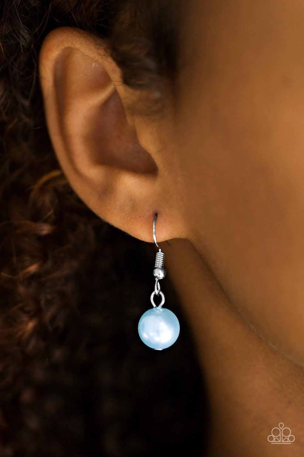 Paparazzi Accessories Spring Social - Blue Varying in size, three strands of timeless blue pearls swing from the bottom of a shimmery silver chain. Dainty crystal-like beads are sprinkled between the pearl accents, adding classic shimmer to the elegant pa