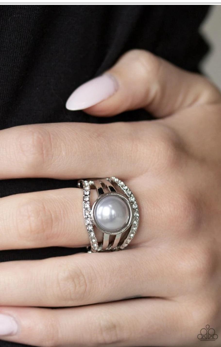 Paparazzi Accessories A Big Break - Silver Radiating with glassy white rhinestones, row after row of glittering silver bars arc across the finger. A pearly silver bead is pressed into the center of the layered bands, adding a dramatically refined finish t