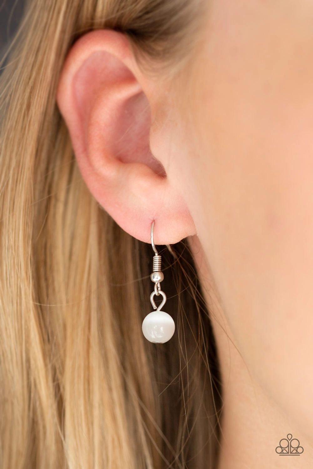 Paparazzi Accessories Love of My Life - White Chiseled into a tranquil heart, a white moonstone is pressed into the center of an airy silver heart frame radiating with sections of glittery white rhinestones for a romantic finish. Features an adjustable cl