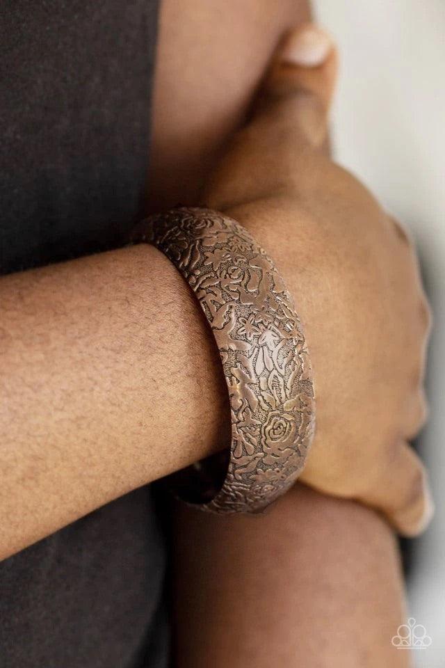 Paparazzi Accessories Garden Villa - Copper Brushed in an antiqued finish, a rosy floral pattern is embossed across a thick copper bangle for a seasonal flair. Jewelry