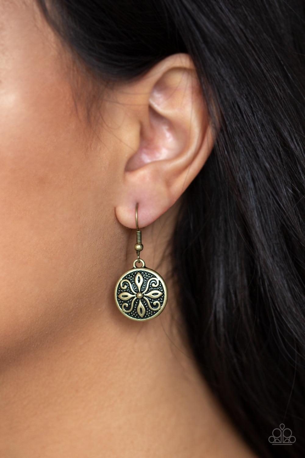 Paparazzi Accessories Tropical Trance - Brass Brushed in an antiqued shimmer, a dainty brass disc is embossed in a frilly tactile pattern for a seasonal flair. Earring attaches to a standard fishhook fitting. Jewelry