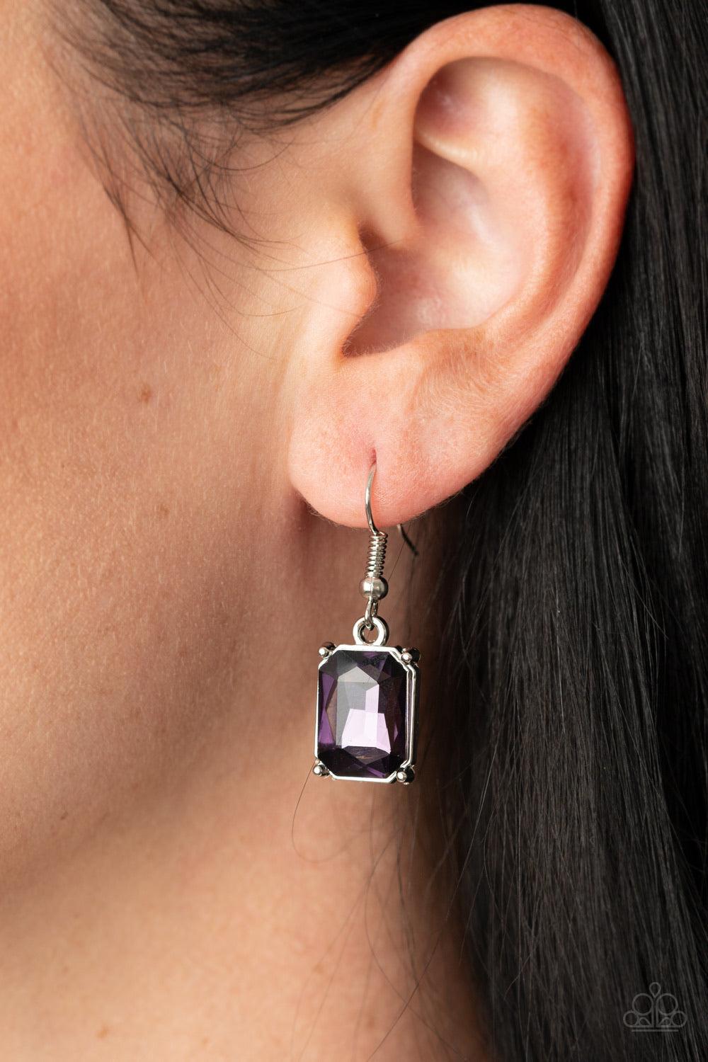 Paparazzi Accessories Deep Freeze Diva - Purple Deep Freeze Diva - Purple P2ST-PRXX-080XX Featuring regal emerald style cuts, an oversized collection of purple rhinestones dramatically link below the collar for an icy finish. Features an adjustable clasp