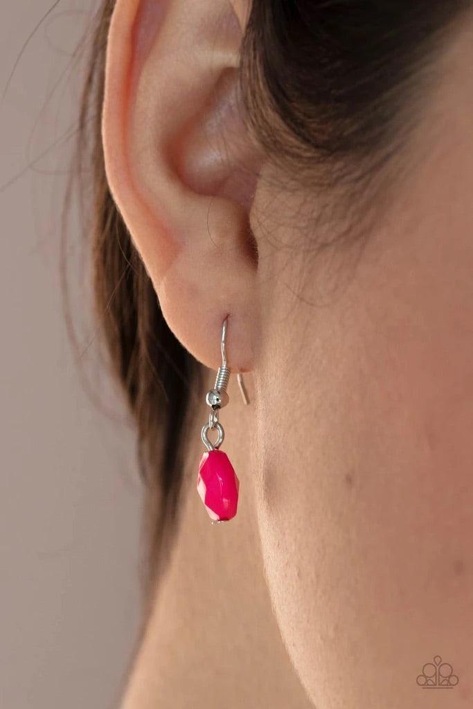 Paparazzi Accessories Glossy Glamorous - Pink Featuring glassy, polished, and opaque finishes, a faceted collection of pink beads join hammered silver discs along a shiny silver chain, creating a colorful display across the chest. Features an adjustable c