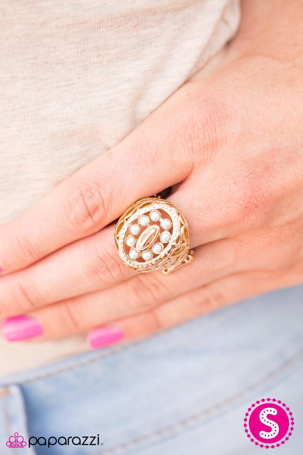 Paparazzi Accessories Full Tilt - Gold Glistening gold ovals climb the finger, stacking into an abstract frame. Dainty white pearls are pressed into the center of the frame, adding a neutral splash of color to the spunky asymmetrical palette. Jewelry