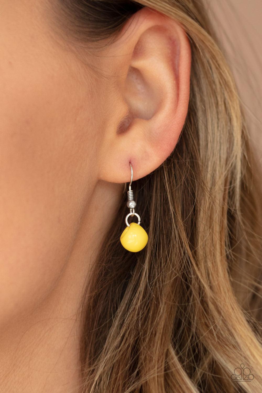 Paparazzi Accessories Bubbly Brilliance - Yellow A bubbly collection of imperfect silver, opaque, and yellow beads are threaded along an invisible wire below the collar, creating a colorful cluster. Features an adjustable clasp closure. Jewelry