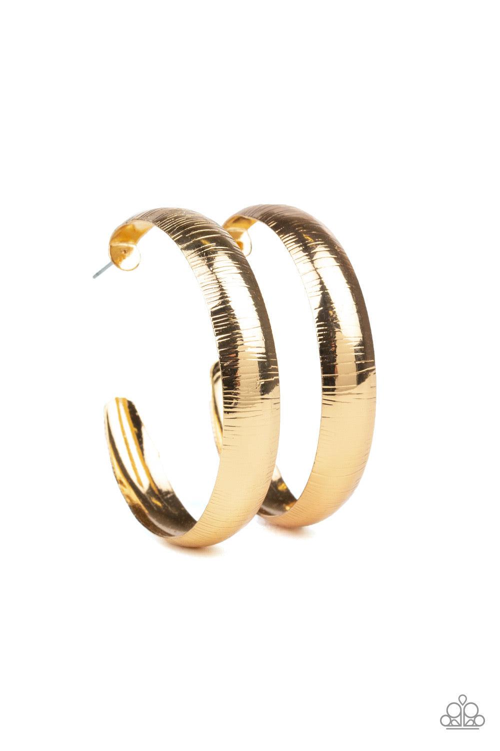 Paparazzi Accessories Hoop Wild - Gold Etched in a shimmery linear pattern, a thick gold hoop curls around the ear for some classic edge. Earring attaches to a standard post fitting. Hoop measures approximately 2" in diameter. Jewelry
