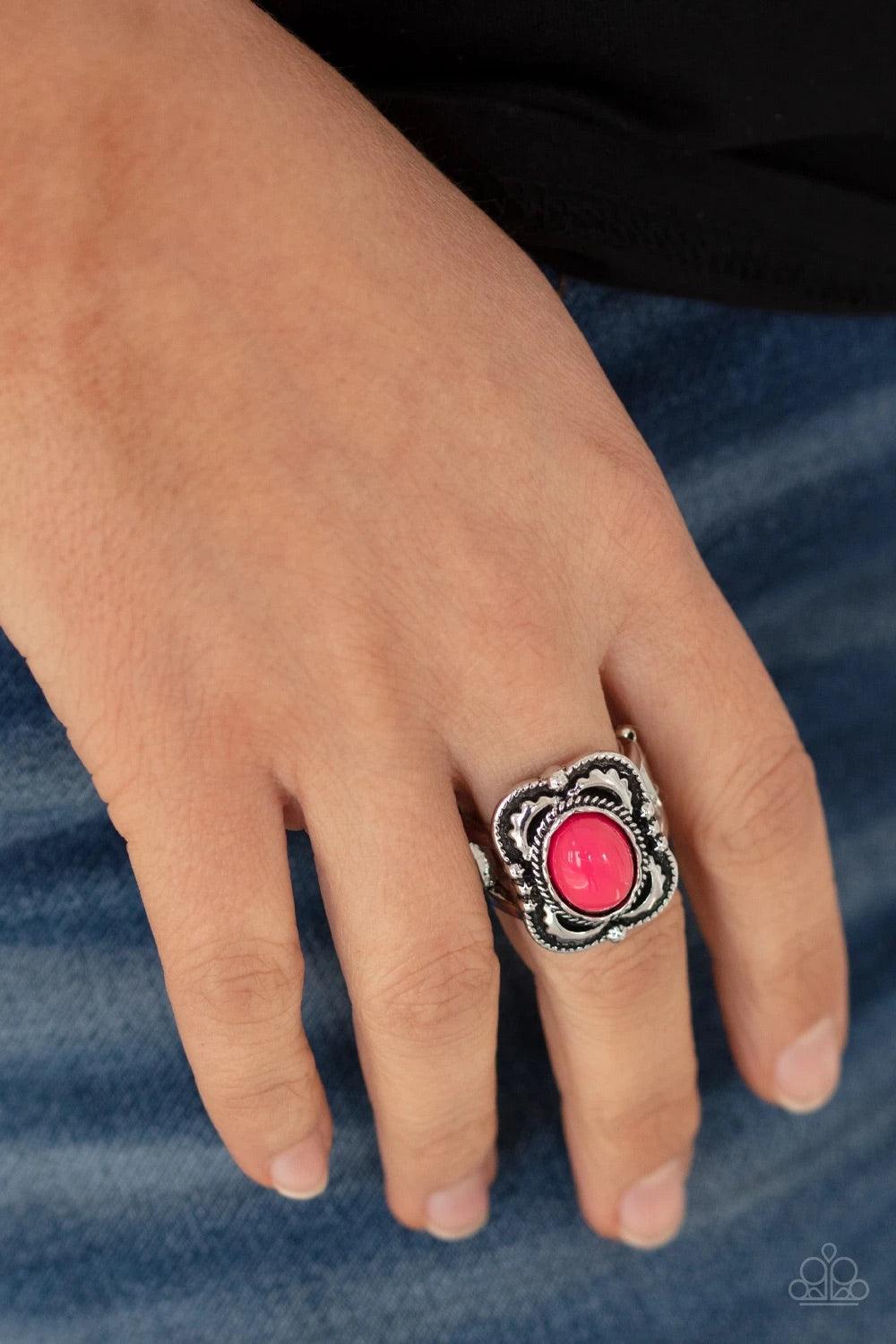 Paparazzi Accessories Vivaciously Vibrant - Pink A flamboyant pink bead is encircled inside a metallic ropelike fitting atop a decoratively embossed silver frame, creating a vivacious pop of color. Features a stretchy band for a flexible fit. Jewelry