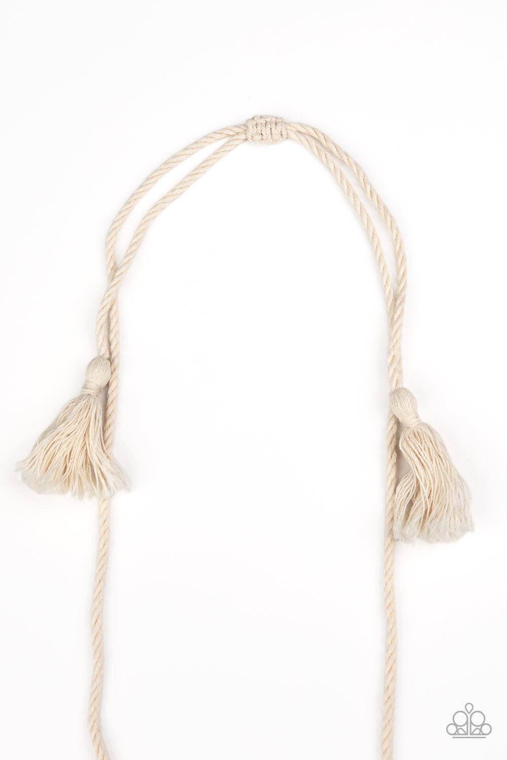 Paparazzi Accessories Macrame Mantra - White Soft twine-like cording decoratively knots into a macramé inspired pendant at the bottom of lengthened strands of twisted cording. Featuring frayed ends, excess cording streams from the bottom of the knotted ce