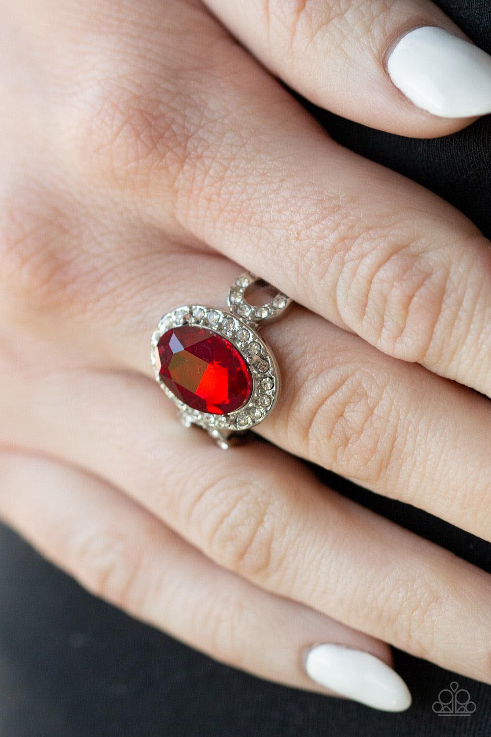 Paparazzi Accessories Magnificent Majesty - Red An oval red gem is pressed into the center of a dainty silver frame radiating with glassy white rhinestones for a regal flair. Features a dainty stretchy band for a flexible fit. Jewelry