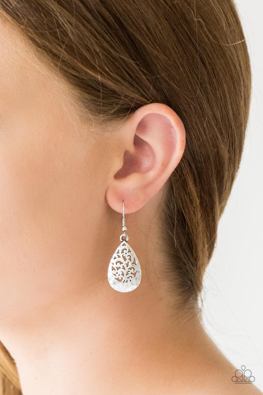 Paparazzi Accessories New Nouveau - Silver Brushed in an antiqued shimmer, delicately hammered filigree climbs a dainty silver teardrop for a whimsical look. Earring attaches to a standard fishhook fitting. Jewelry Sets