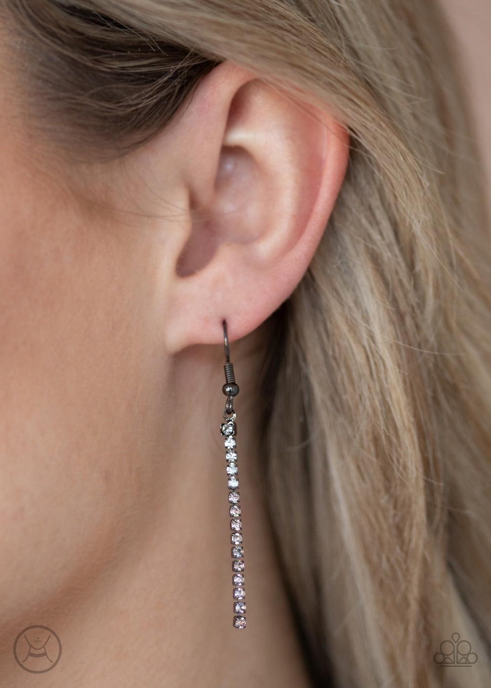 Paparazzi Accessories Catch You Layer! - Black Hints of glittery white rhinestones peek out between layer after layer of glistening gunmetal chains, creating a dramatic display around the neck. Features an adjustable clasp closure. Sold as one individual