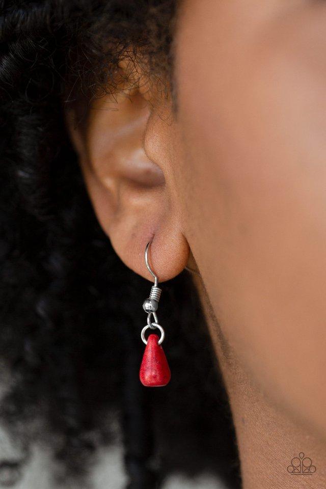 Paparazzi Accessories Extinct Species - Red Red teardrop stones and classic silver beads are threaded along an invisible wire. The earthy beads alternate below the collar, creating a wild fringe. Features an adjustable clasp closure. Sold as one individua