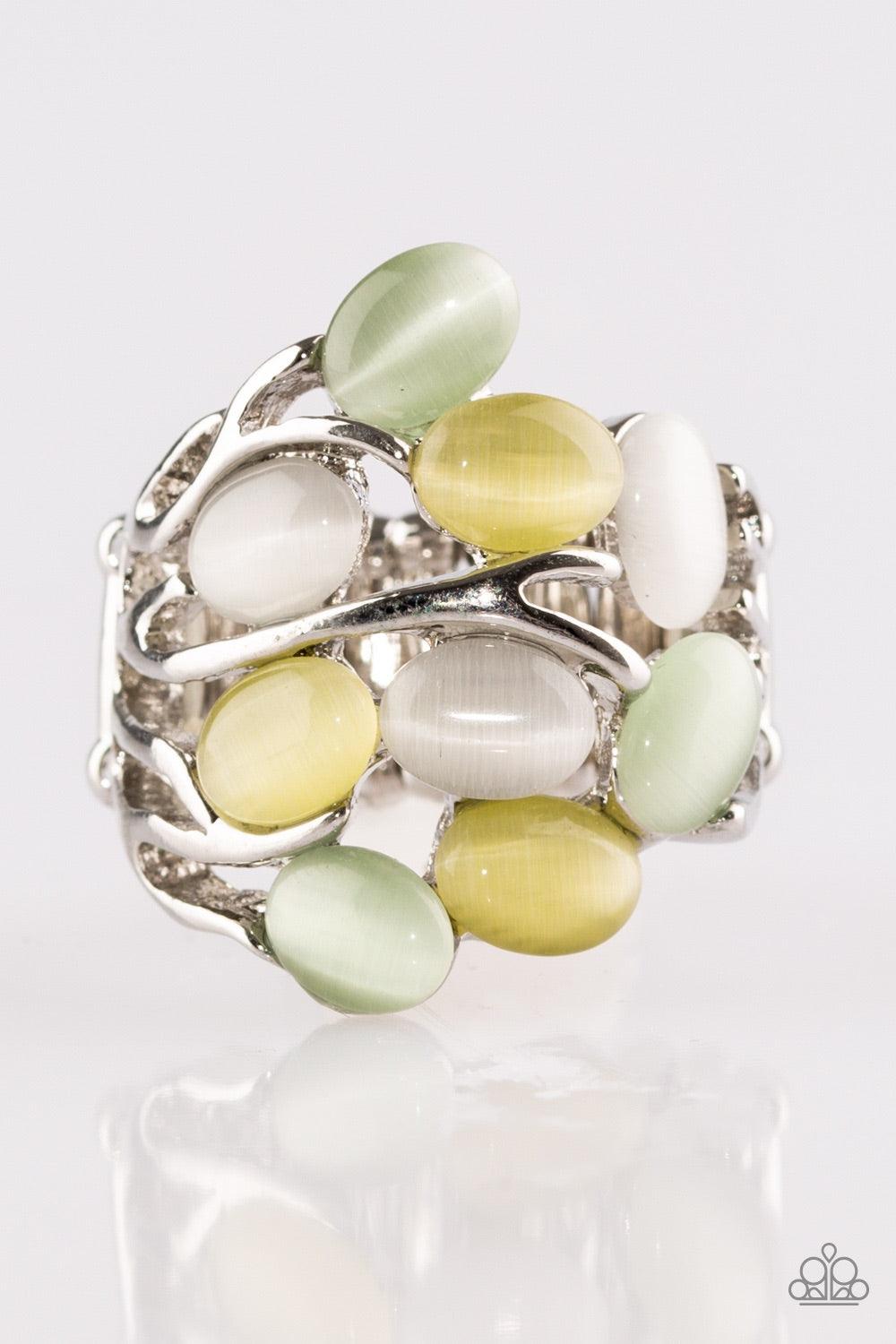 Paparazzi Accessories Really Starting to GLOW on Me ~Green Attached to shimmery silver bands, glowing moonstones are scattered across the finger for a whimsical look. Features a stretchy band for a flexible fit.