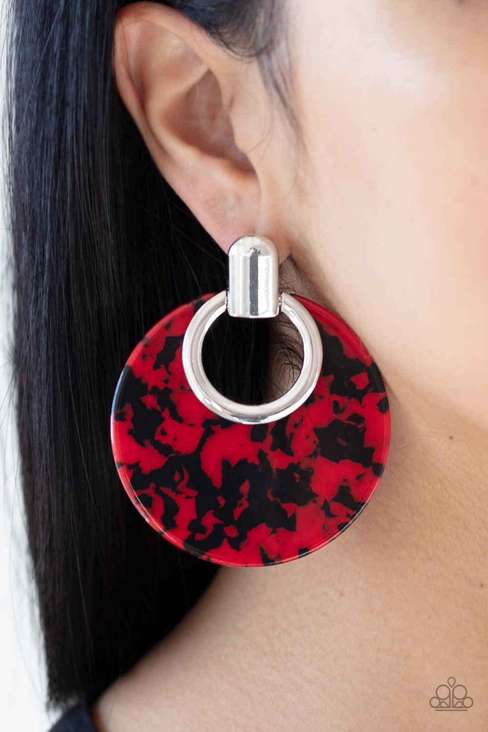 Paparazzi Accessories Metro Zoo - Red Featuring a red and black tortoise shell finish, a colorful acrylic frame attaches to a sleek silver fitting for a retro look. Earring attaches to a standard post fitting. Color may vary. Sold as one pair of post earr
