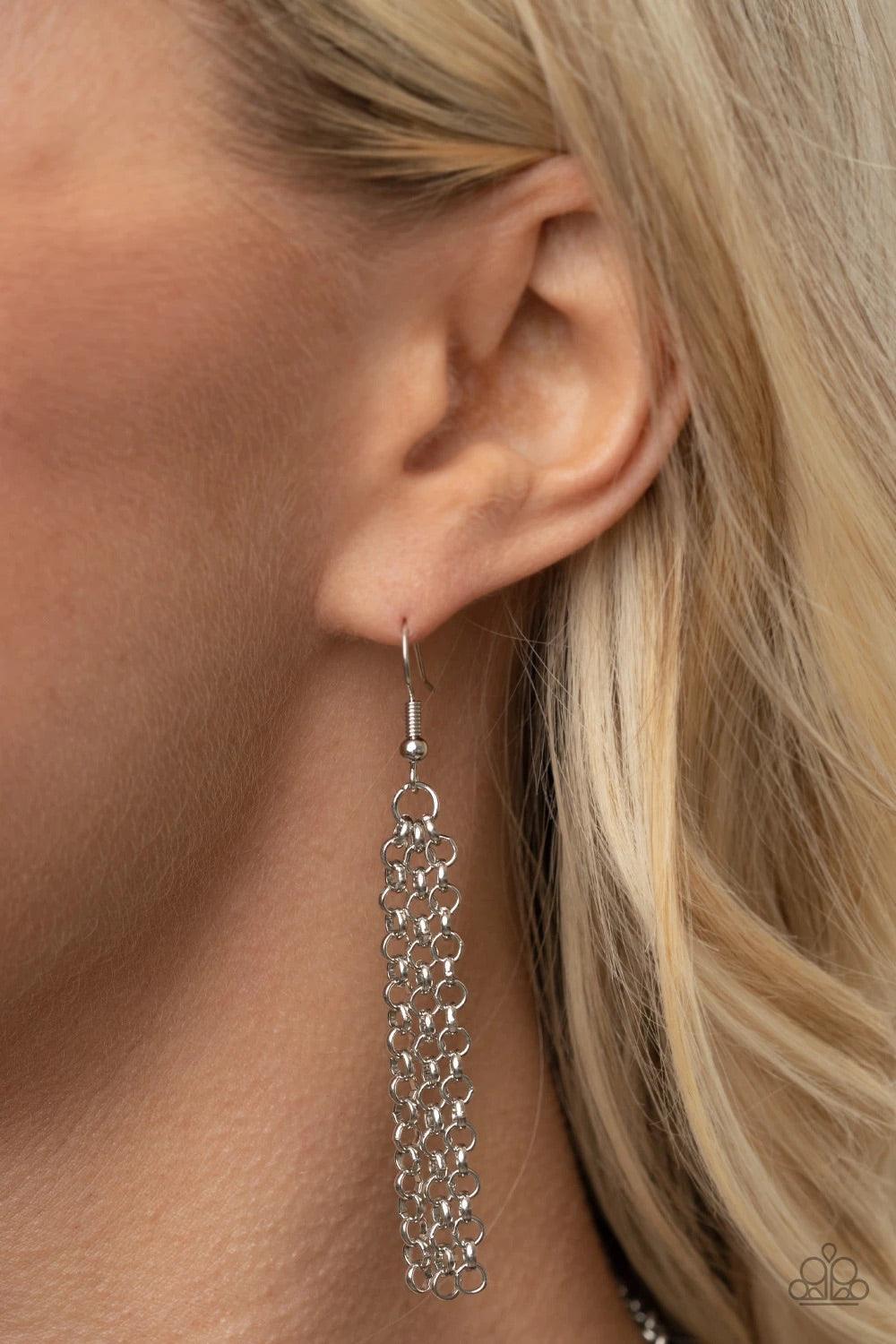 Paparazzi Accessories You the TALISMAN! - Purple Pairs of faceted silver beads and glassy white emerald cut gems flank an oversized emerald cut purple gem atop an antiqued silver half moon frame. A smoky triangular cut gem adorns the bottom of the pendant