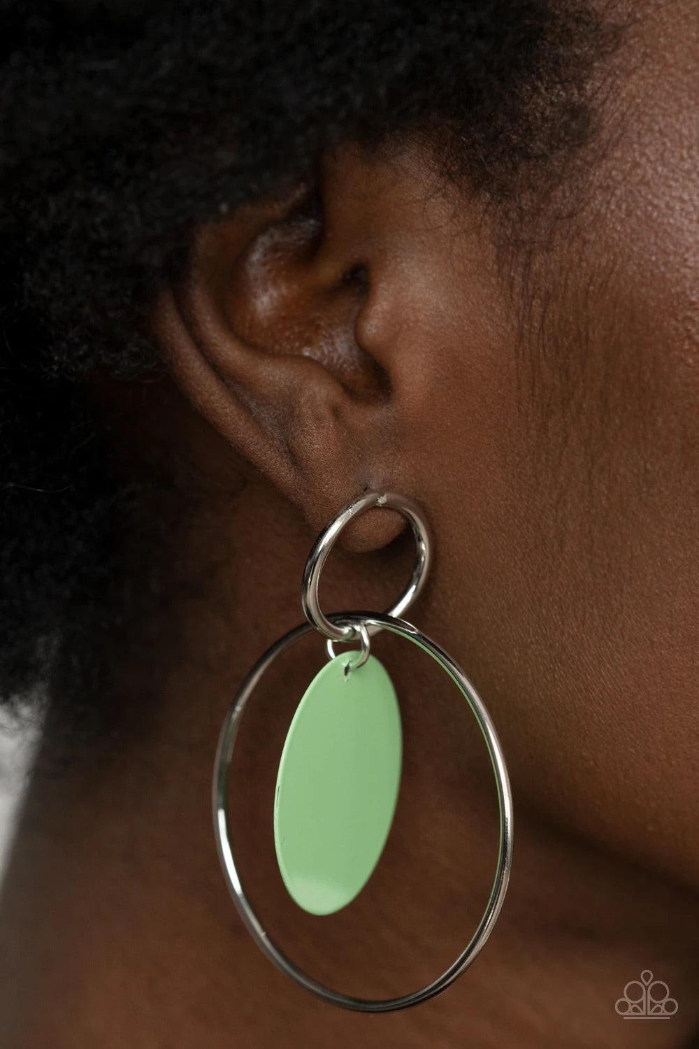 Paparazzi Accessories POP, Look. And Listen - Green A minty Green Ash disc swings from two interlocking silver hoops, creating a flirtatious pop of color. Earring attaches to a standard post fitting. Sold as one pair of post earrings. Jewelry