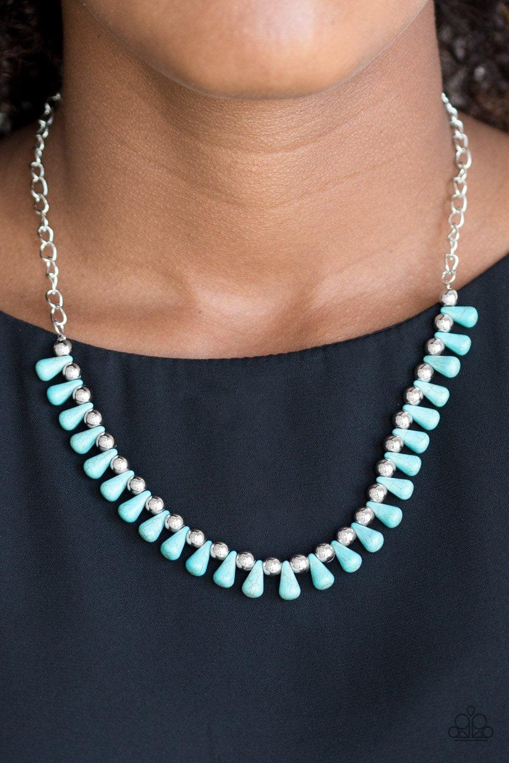 Paparazzi Accessories Extinct Species - Blue Turquoise teardrop stones and classic silver beads are threaded along an invisible wire. The earthy beads alternate below the collar, creating a wild fringe. Features an adjustable clasp closure. Sold as one in