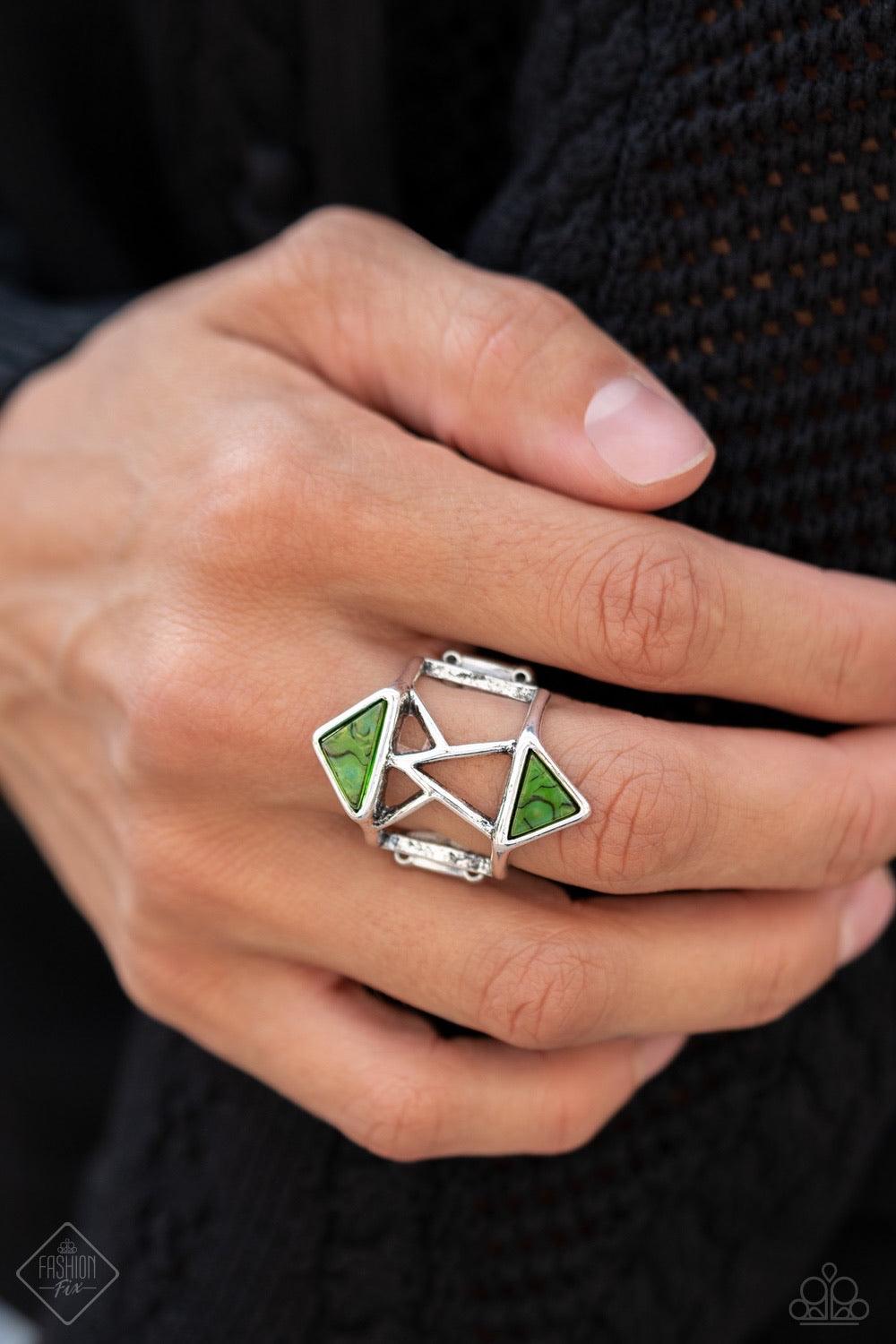 Paparazzi Accessories Making Me Edgy - Green Featuring an abstract pattern, a pair of green triangular acrylic frames flank an airy silver band pieced together by stenciled geometric patterns for an edgy look. Features a stretchy band for a flexible fit.