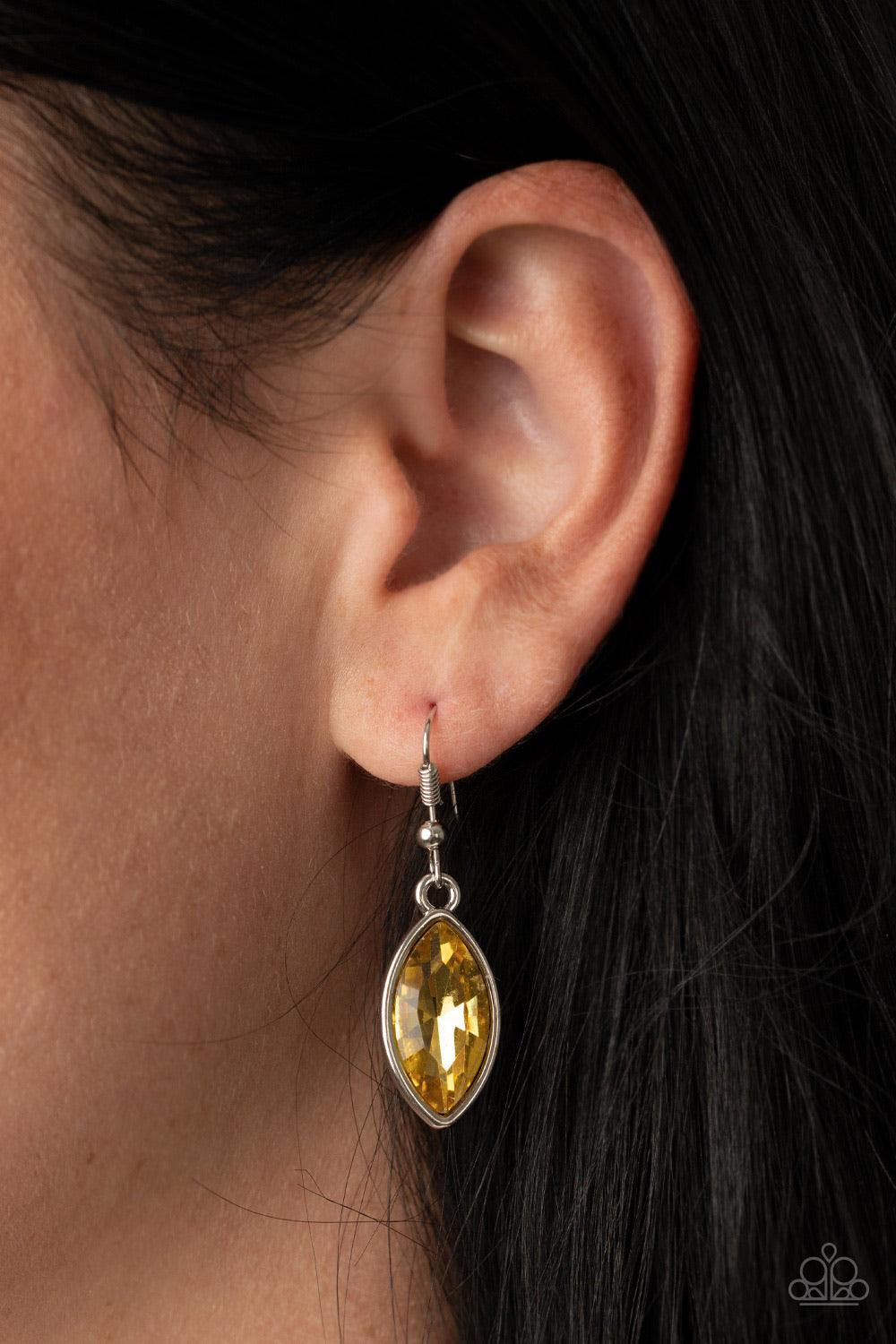 Paparazzi Accessories Unlimited Sparkle - Yellow Featuring a regal marquise style cut, a dramatically oversized golden yellow rhinestone swings from a chunky silver chain, creating a gorgeous pendant below the collar. Features a toggle closure. Sold as on