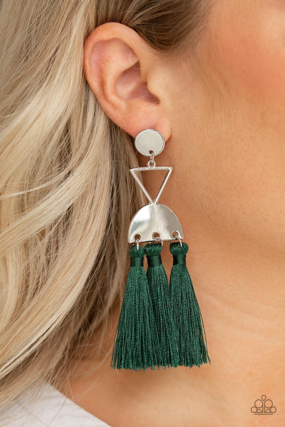 Paparazzi Accessories Tassel Trippin - Green A shimmery silver disc, airy silver triangle, and shimmery half moon frame link into a geometric lure. Three green threaded tassels swing from the bottom of the stacked frame for a trendy finish. Earring attach