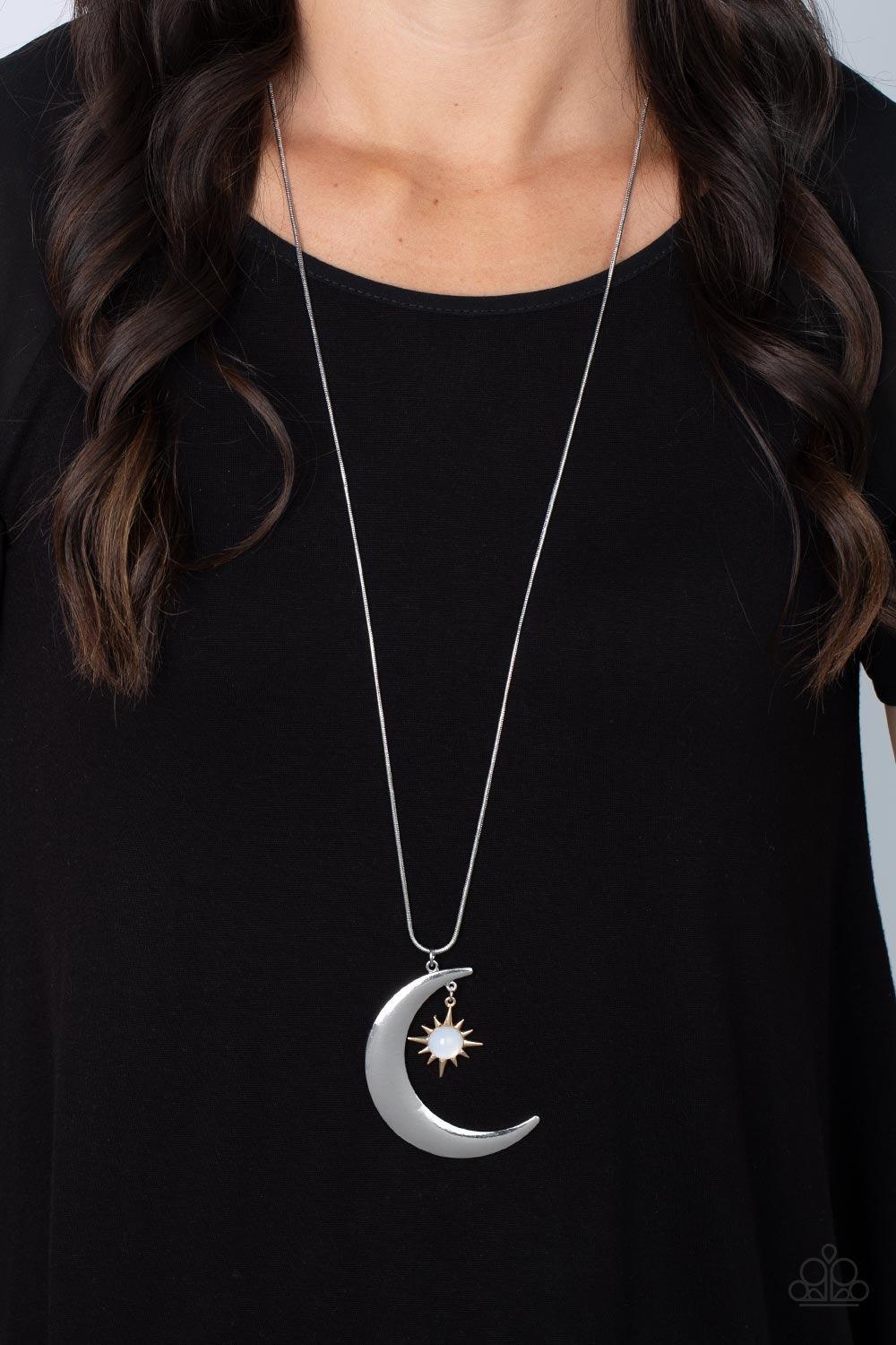 Paparazzi Accessories Astral Ascension- Multi An opaque white bead is pressed into the center of a gold star that dances from the top of a silver half moon pendant, creating a celestial pendant at the bottom of a lengthened silver snake chain. Features an
