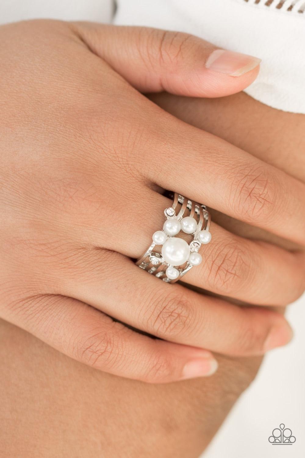 Paparazzi Accessories Meet Me At The Altar - White Bubbly white pearls and glittery white rhinestones are sprinkled across airy silver bands, creating a romantic centerpiece. Features a stretchy band for a flexible fit. Jewelry