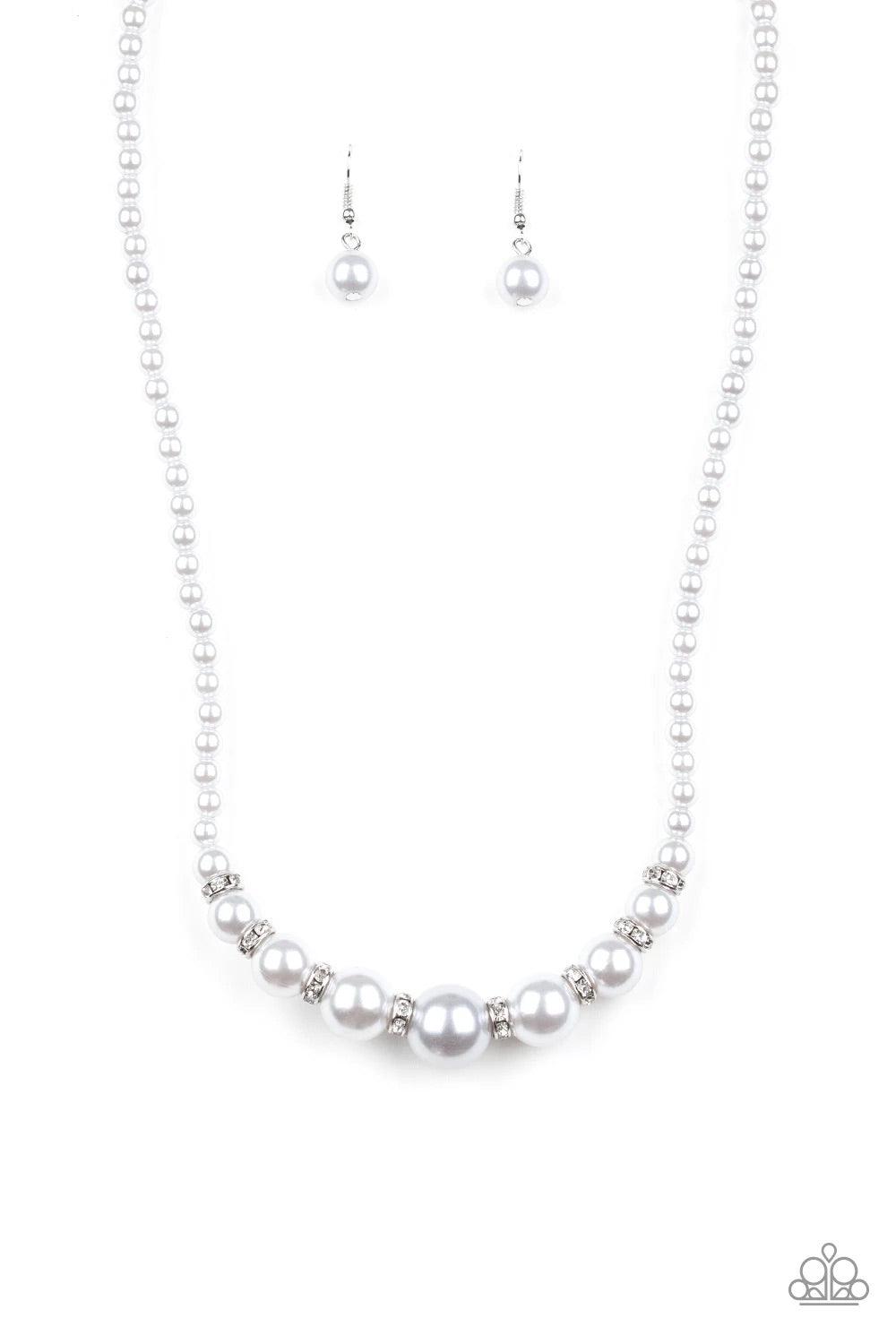 Paparazzi Accessories SoHo Sweetheart - Silver Threaded along an invisible wire, dainty silver pearls give way to an alternating collection of larger silver pearls and white rhinestone encrusted rings below the collar for a timeless sparkle. Features an a
