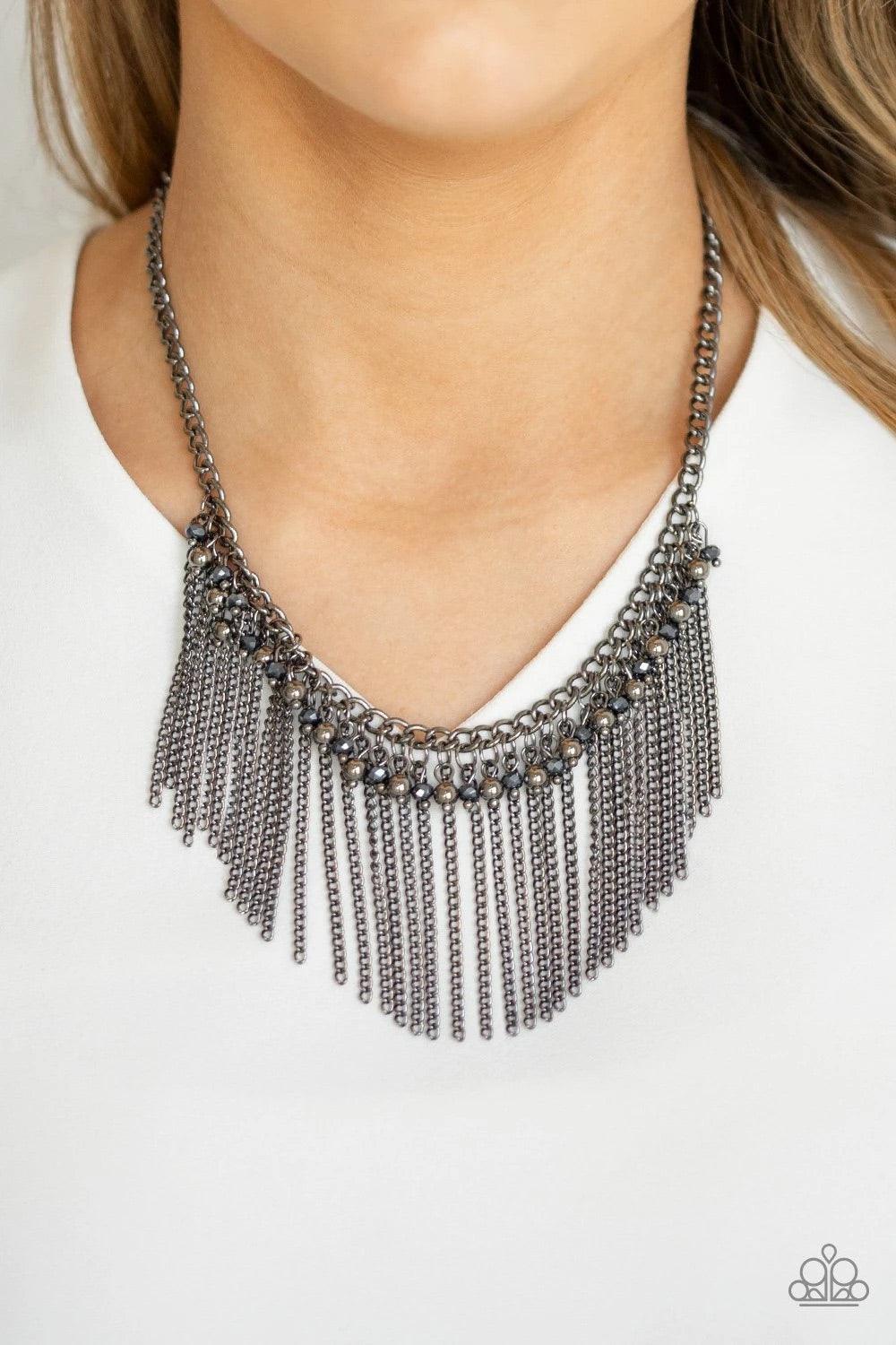 Paparazzi Accessories Divinely Diva - Blue A glistening fringe of shiny gunmetal beads, metallic blue crystal-like beads, and glistening gunmetal chains dangle from the bottom of a classic gunmetal chain, creating an edgy-glamorous fringe below the collar