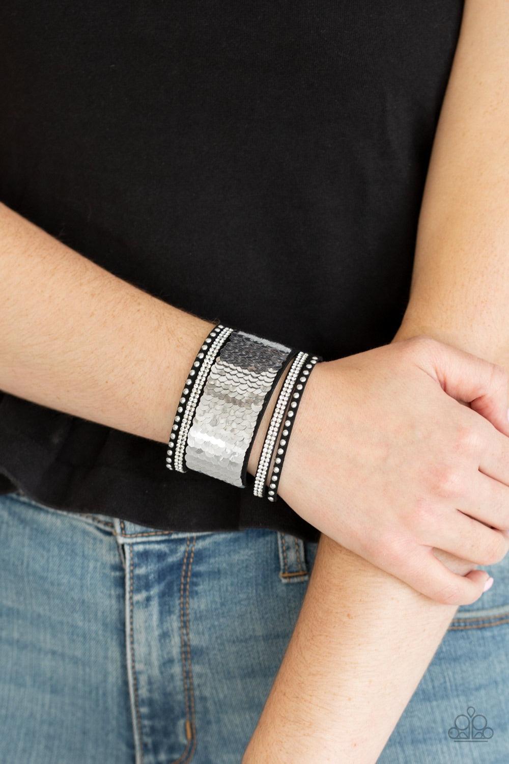 Paparazzi Accessories MERMAIDS Have More Fun - Gold Shiny silver studs, glassy white rhinestones, and shimmering sequins are sprinkled across a thick black suede band that has been spliced into five glittery rows. Bracelet features reversible sequins that