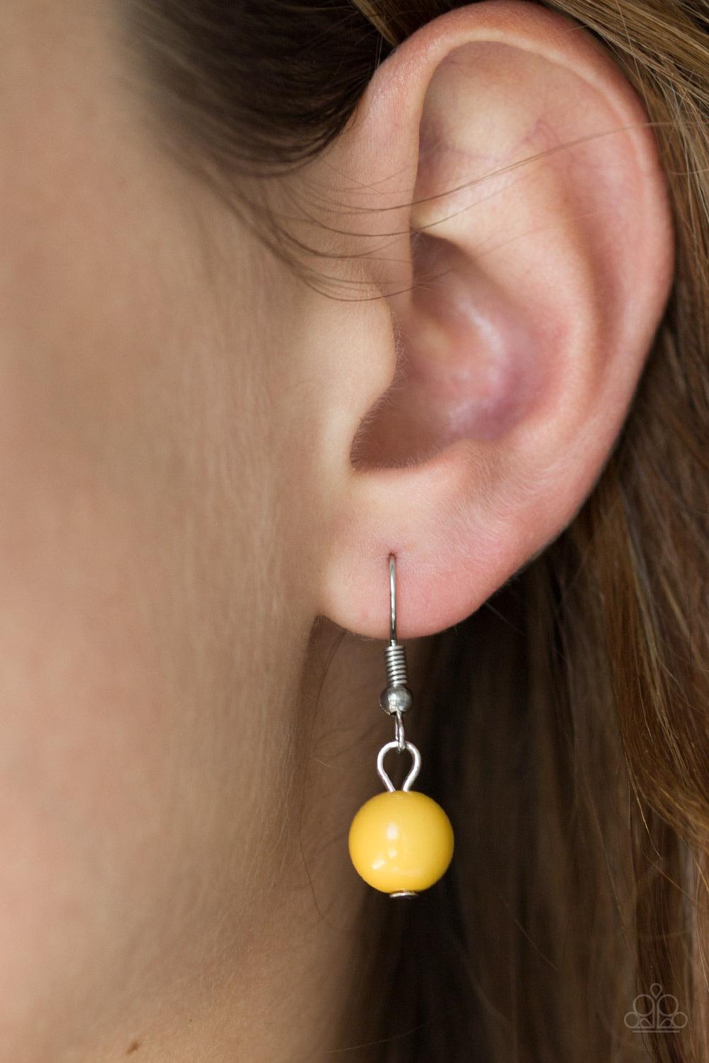 Paparazzi Accessories Flirtatiously Florida ~Yellow Featuring round and asymmetrical shapes, shiny silver and yellow beads swing from the bottom of a bold silver chain, creating a flirtatious fringe below the collar. Features an adjustable clasp closure.