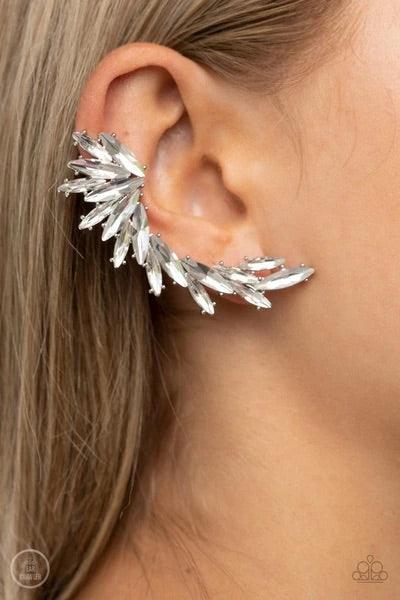 Paparazzi Accessories Because ICE Said So - White An explosion of marquise-cut white rhinestones delicately climb the ear, coalescing into an icy frame. Earring attaches to a standard post fitting. Features a clip-on fitting at the top for a secure fit. S