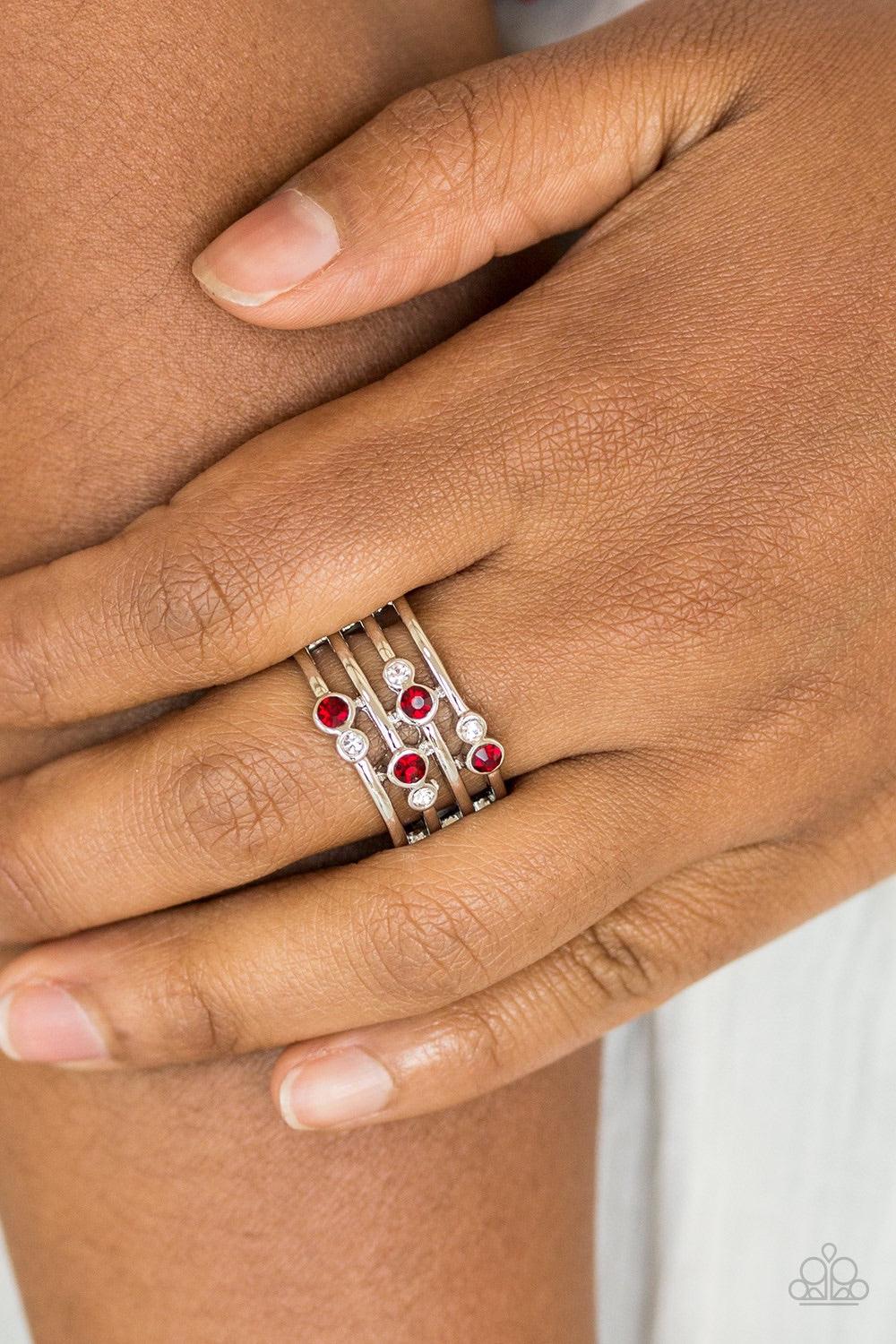 Paparazzi Accessories Sparkle Showdown - Red Glittery red and white rhinestones are scattered along arcing silver bands, coalescing into a refined frame. Features a stretchy band for a flexible fit. Jewelry
