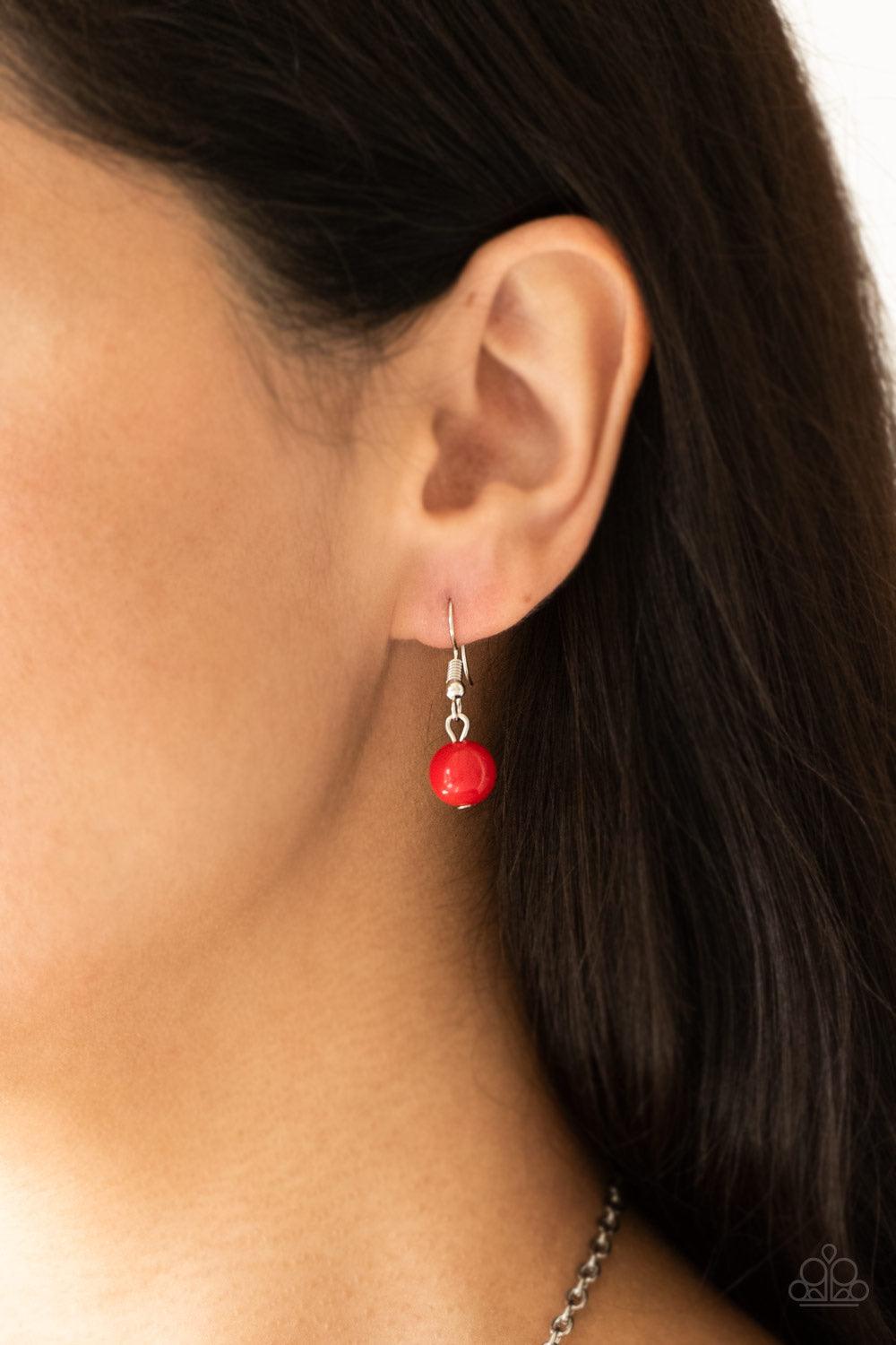 Paparazzi Accessories Vividly Vivid - Red Polished red, faceted crystal-like and delicately hammered silver hoops give way to mismatched silver chains down the chest for a whimsical look. Features an adjustable clasp closure. Sold as one individual neckla